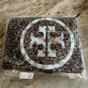 Brand new, never opened package of 3 designer Tory Burch masks. Retail for $35.